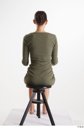 Vanessa Angel  casual dressed green long sleeve dress sitting whole body  jpg